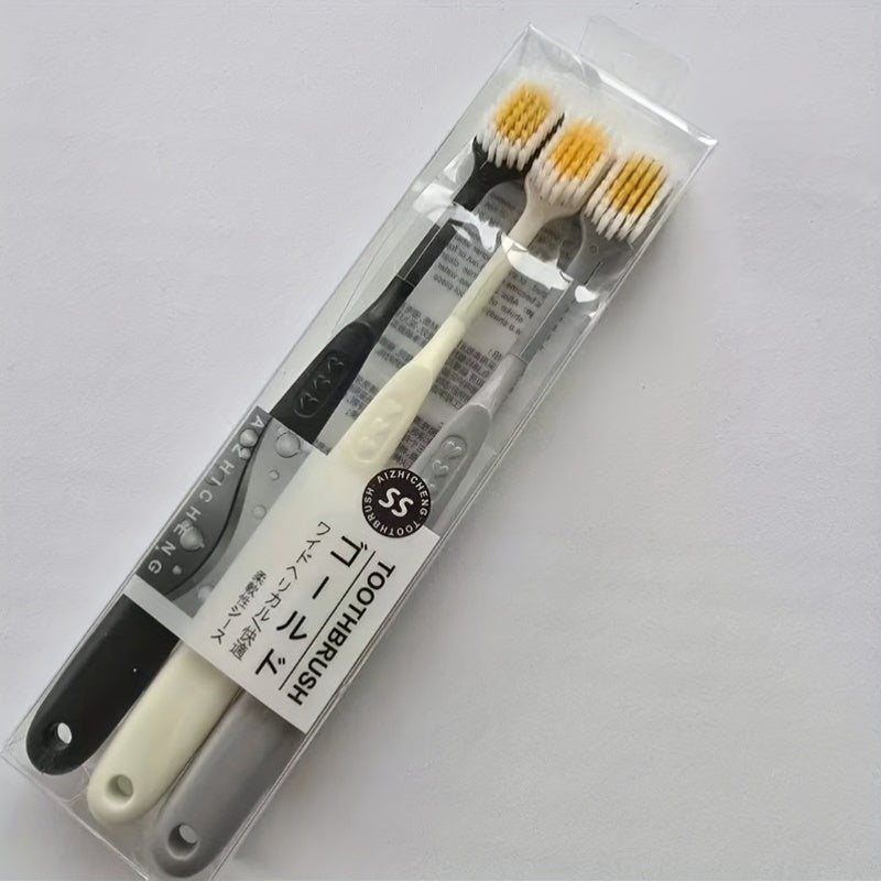Set of Three Ultra-Soft Bristle Toothbrushes with a Wide Head, Ideal for Adult Use. The Design Helps in Effectively Eliminating Plaque While Being Gentle on Sensitive Teeth And Gums. Offered in Black, White, And Gray Colors with an Ergonomic Handle