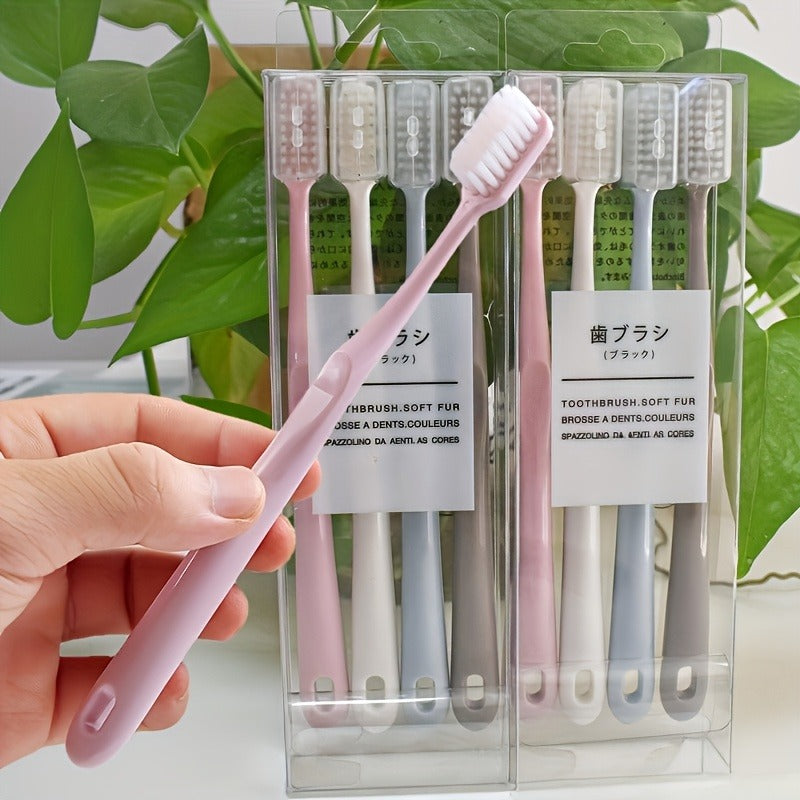 Set of Four Japanese Toothbrushes Featuring Soft Bristles And Protective Cases, Designed for Easy Travel. They Are Gentle on Sensitive Teeth And Gums, Available in Pink, Blue, White, And Beige