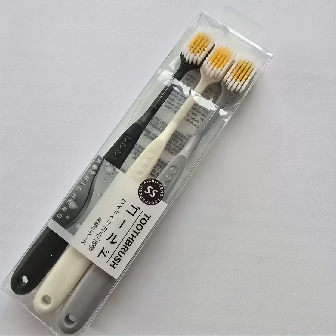 Set of Three Ultra-Soft Bristle Toothbrushes with a Wide Head, Ideal for Adult Use. The Design Helps in Effectively Eliminating Plaque While Being Gentle on Sensitive Teeth And Gums. Offered in Black, White, And Gray Colors with an Ergonomic Handle