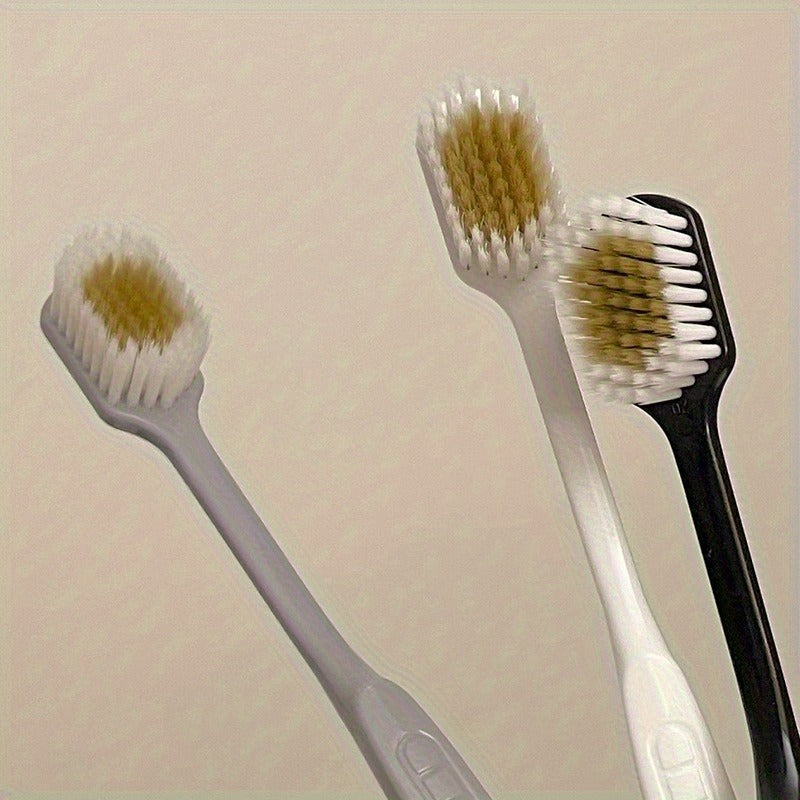Set of Three Ultra-Soft Bristle Toothbrushes with a Wide Head, Ideal for Adult Use. The Design Helps in Effectively Eliminating Plaque While Being Gentle on Sensitive Teeth And Gums. Offered in Black, White, And Gray Colors with an Ergonomic Handle